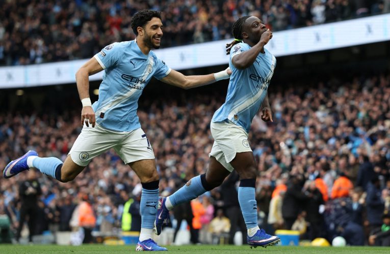 Doku magic earns win for Man City to keep heat on Arsenal